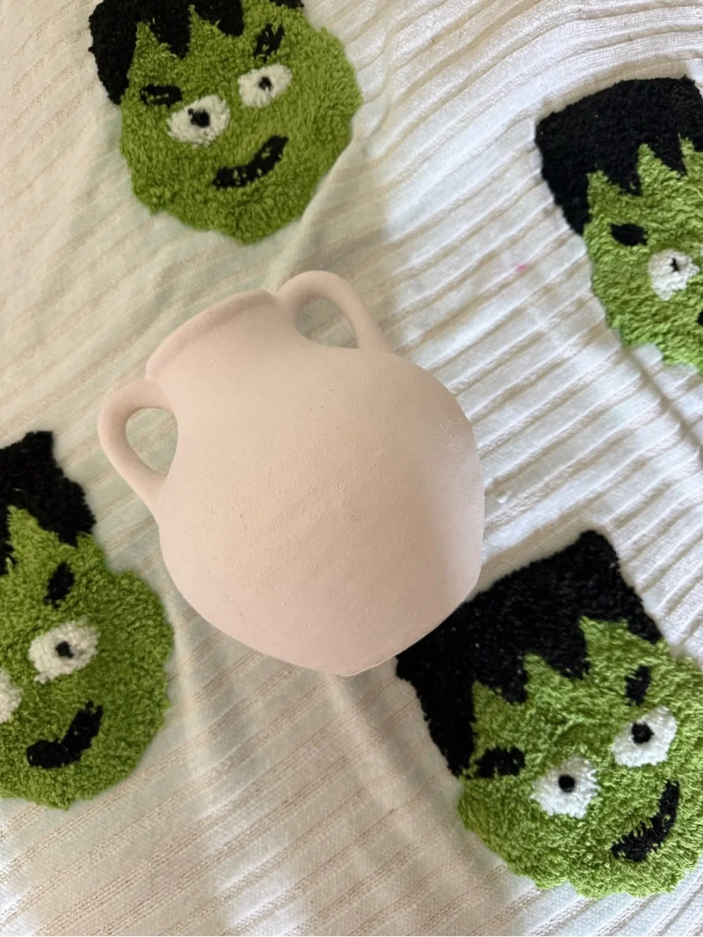 Cream double handled textured small vase